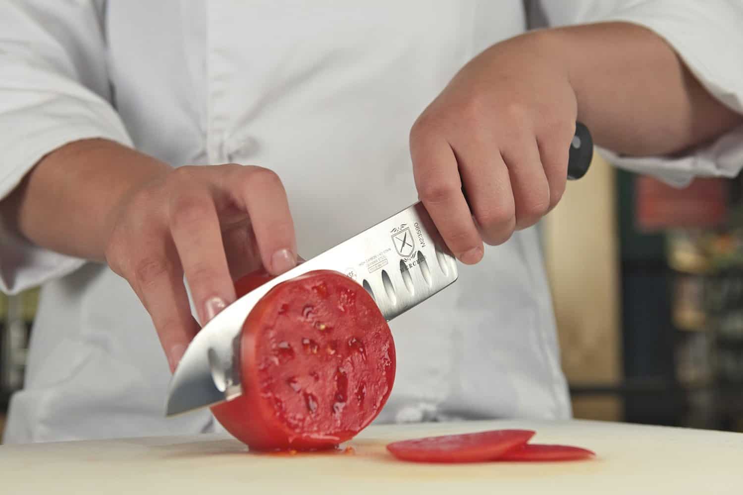 Chef using a Japanese santoku knife
