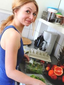 lady preparing fruits and vegetables for juicer